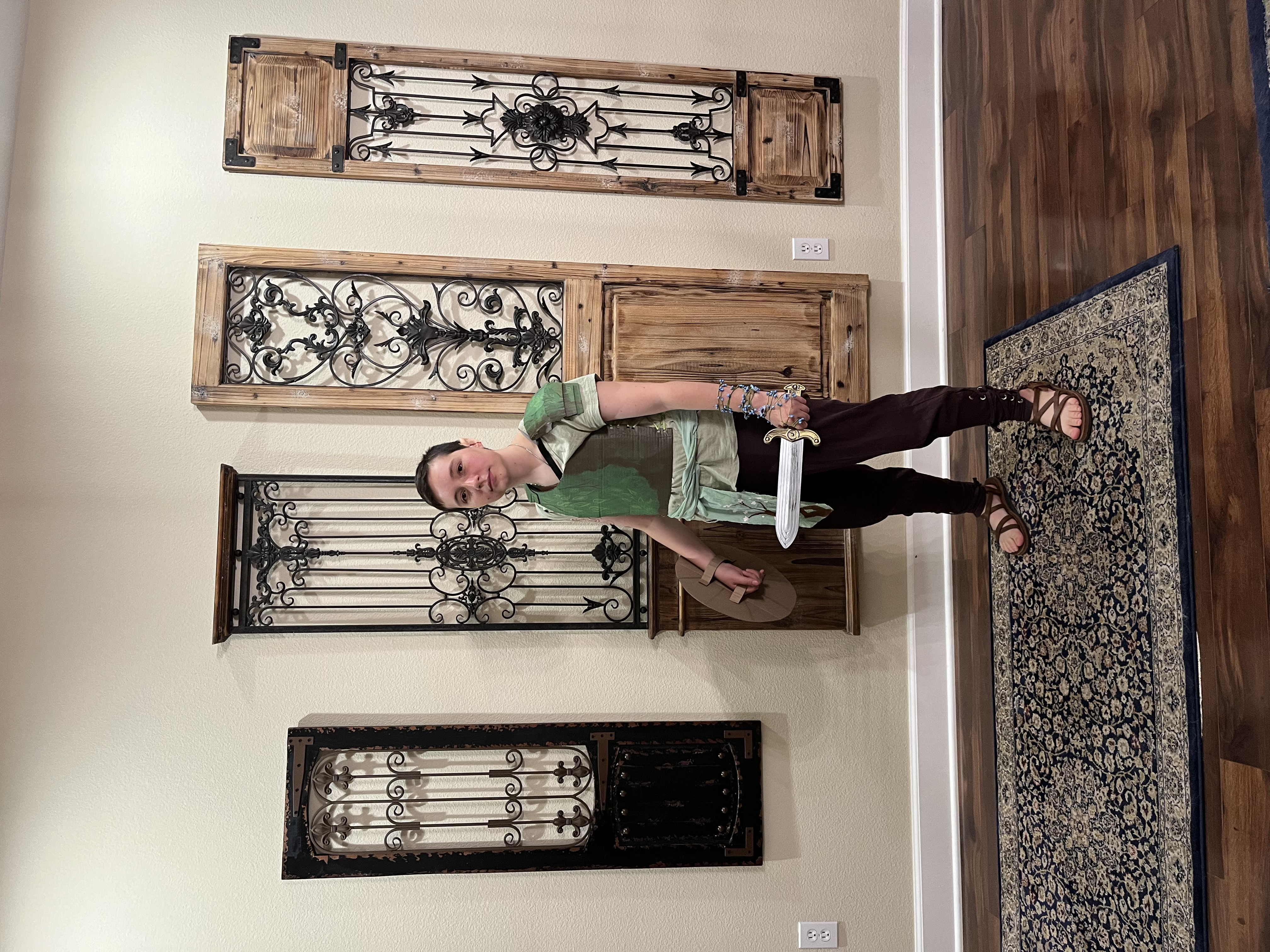 Mia wearing Orym of the Air Ashari Costume with sword and shield at side