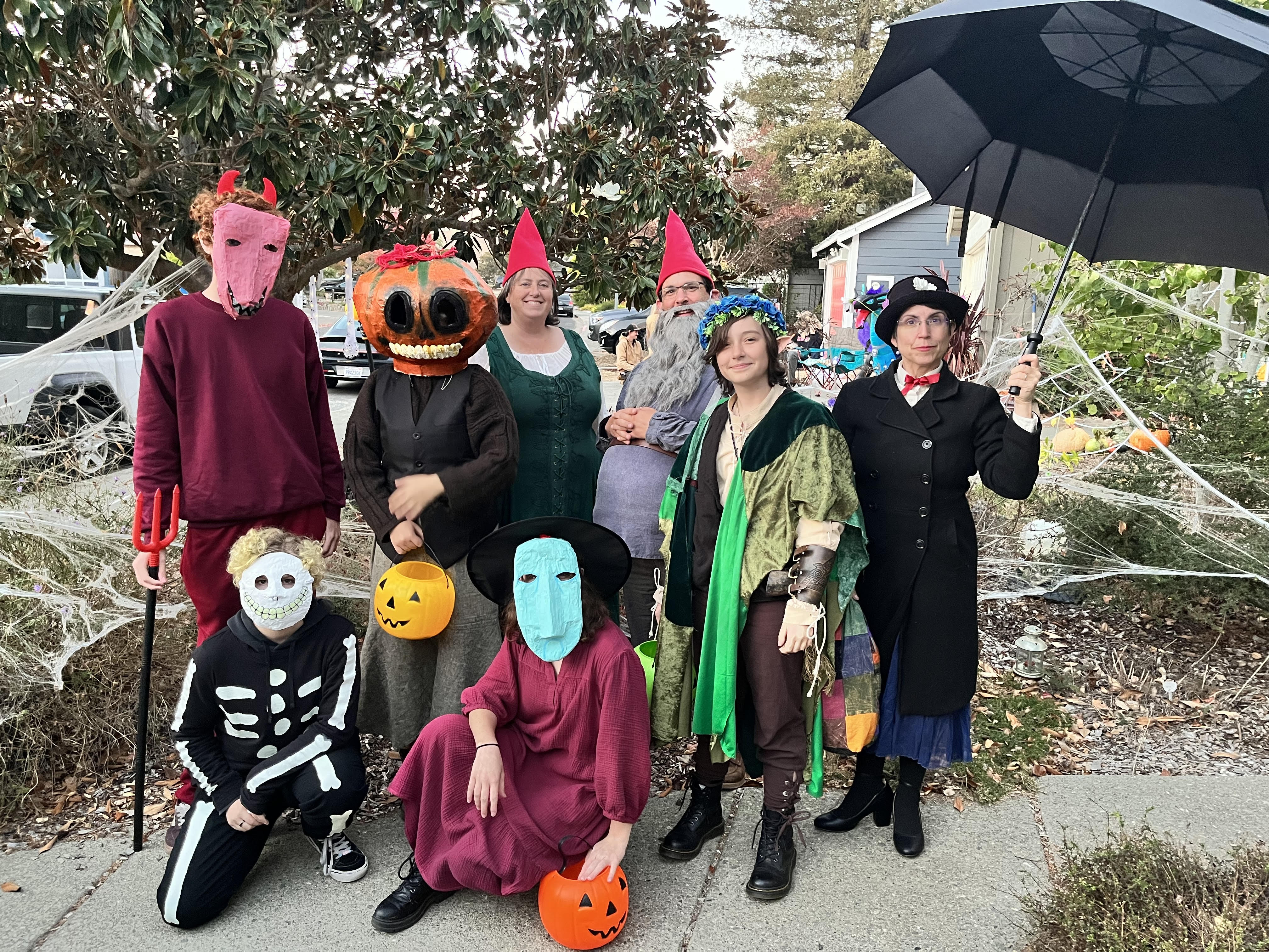 Group of costumed individuals, including: Shock, Lock, and Barrel from Nighmare Before Christmas, two gnomes, a pumpkin headed person, Mary Poppins, and my D&D character Vidar