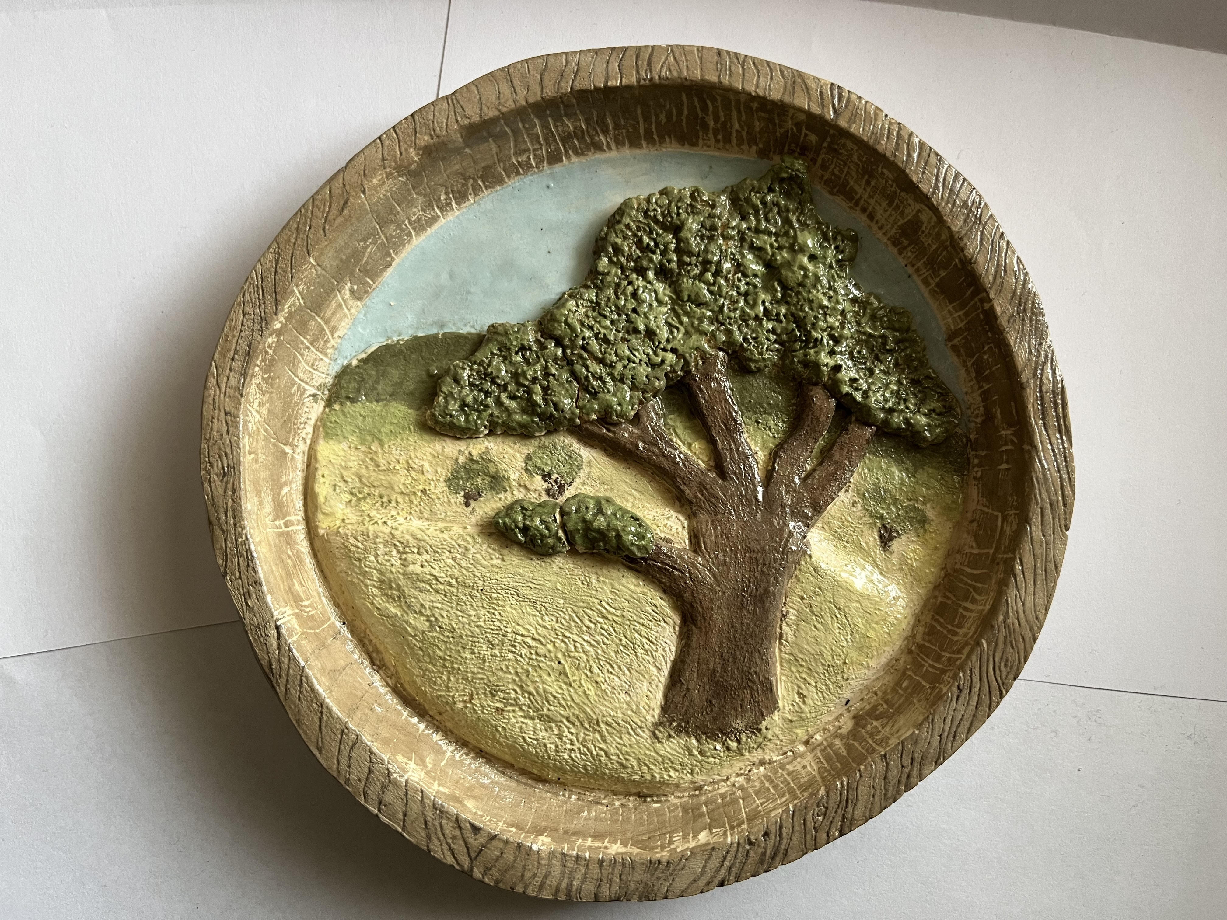 Flat layers of clay create an oak tree standing on a hill