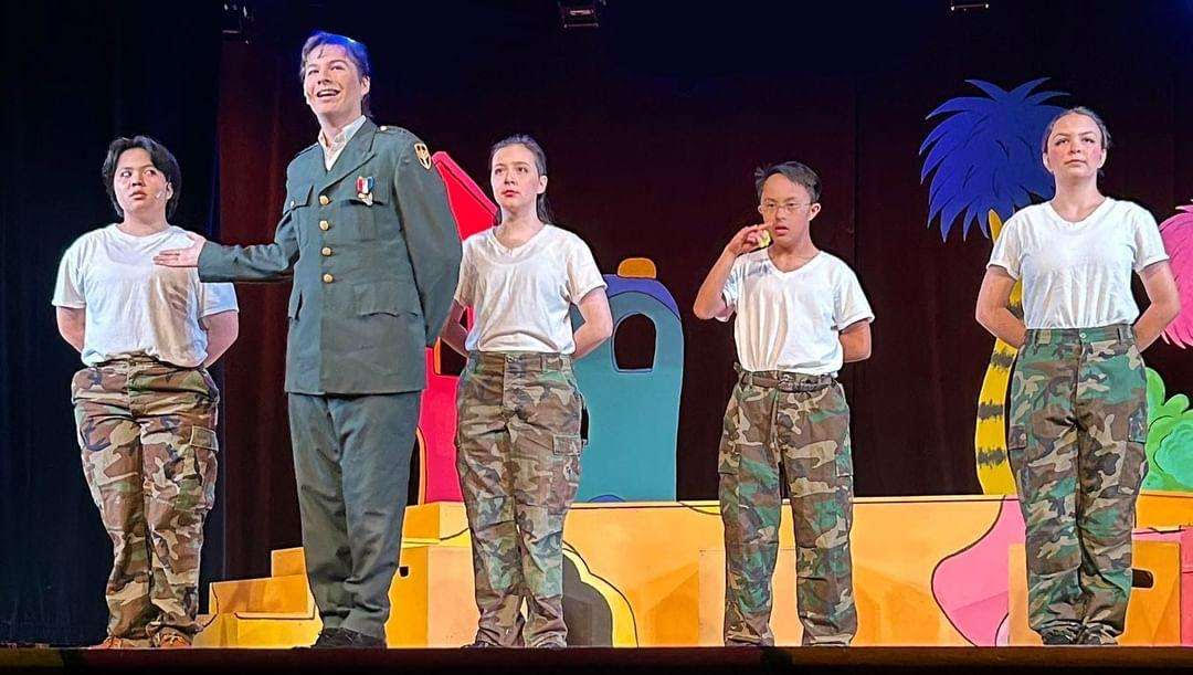 Military Whos stand at attention to General Genghis Kahn Schmitz