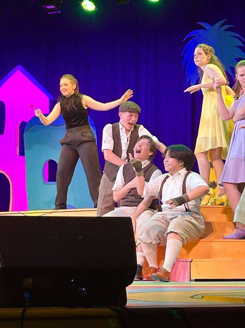 Vlad Vladikoff and Wickersham Brothers taunt Horton (not pictured) with clover held high above